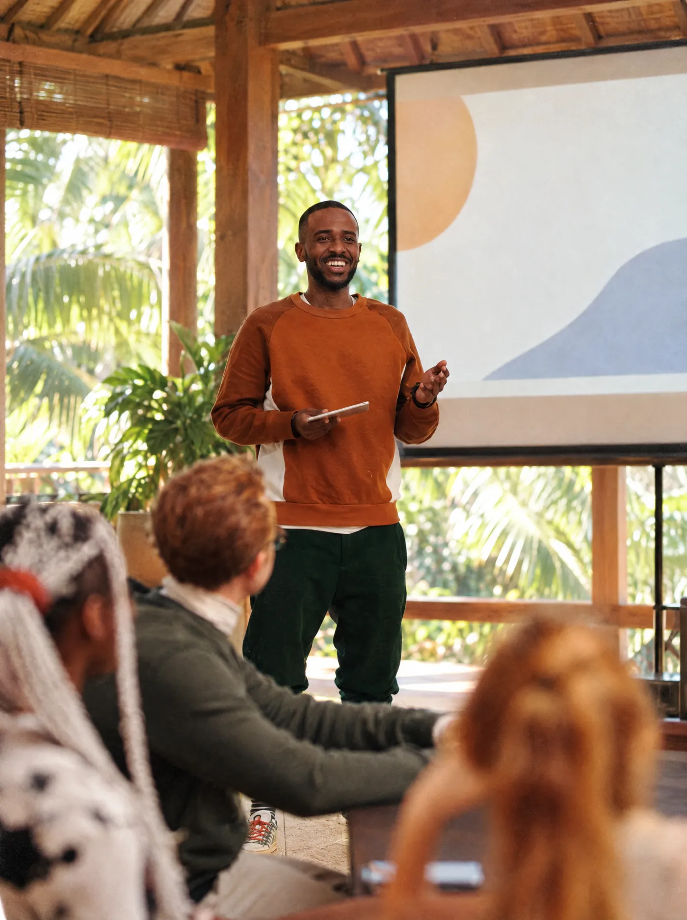 A sales coach running a training session for the team in a Bali office