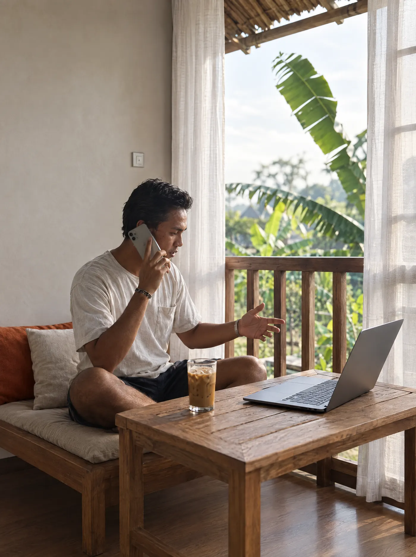 A rep on an early-morning call from the terrace of a Bali guesthouse